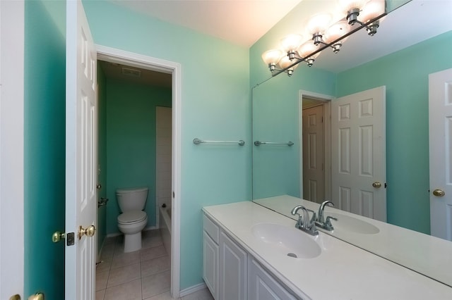 bathroom featuring tile patterned flooring, vanity, and toilet