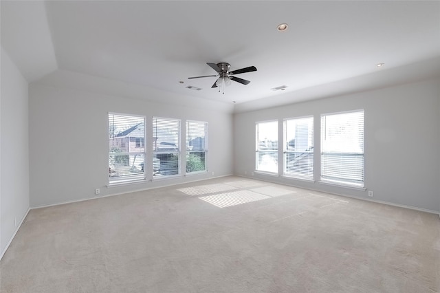 unfurnished room with light colored carpet, ceiling fan, and lofted ceiling