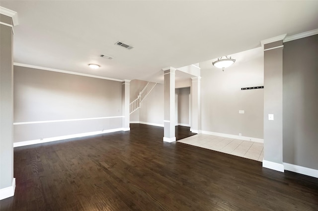 empty room featuring dark hardwood / wood-style floors and ornamental molding