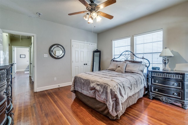 bedroom featuring ceiling fan and dark hardwood / wood-style flooring