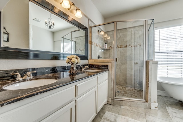 bathroom with tile patterned floors, vanity, and independent shower and bath