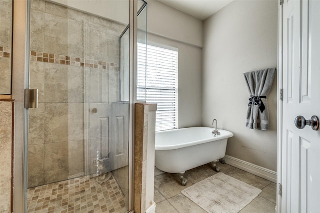 bathroom featuring tile patterned flooring, plenty of natural light, and independent shower and bath