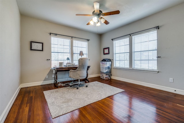 office space with ceiling fan and dark wood-type flooring