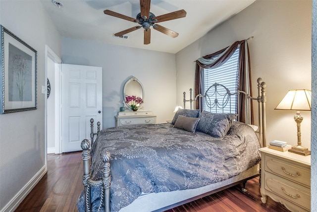 bedroom with ceiling fan and dark hardwood / wood-style floors