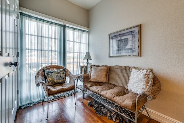 sitting room with wood-type flooring