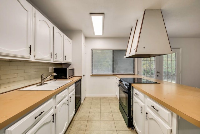 kitchen featuring white cabinetry, sink, and black appliances