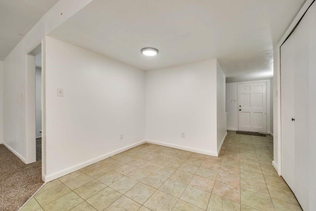 spare room with light tile patterned floors