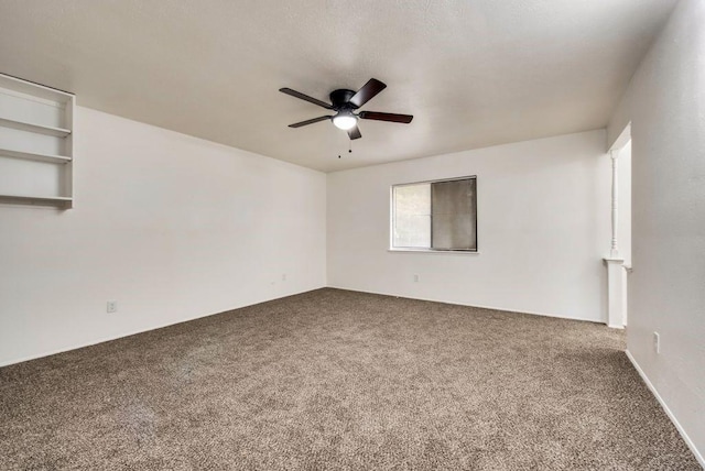 unfurnished room with carpet and ceiling fan