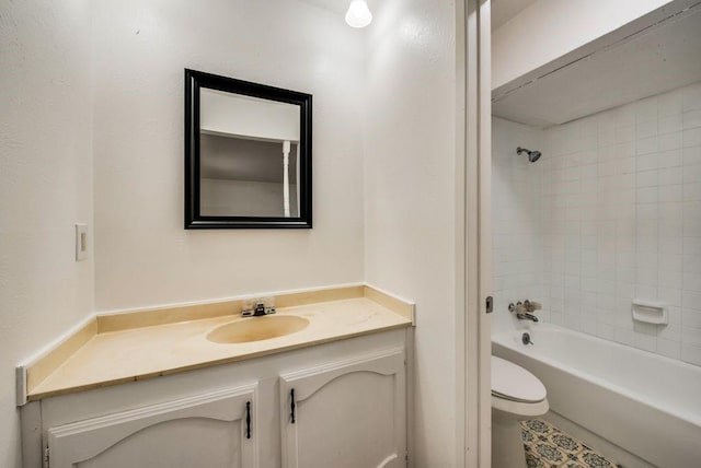 full bathroom with vanity, toilet, and tiled shower / bath combo