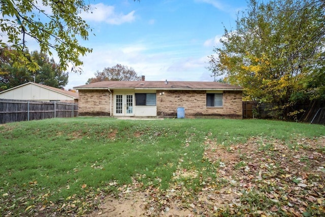 back of house with a yard