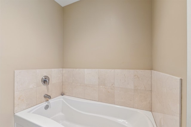 bathroom with tiled tub