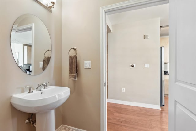 bathroom with hardwood / wood-style flooring