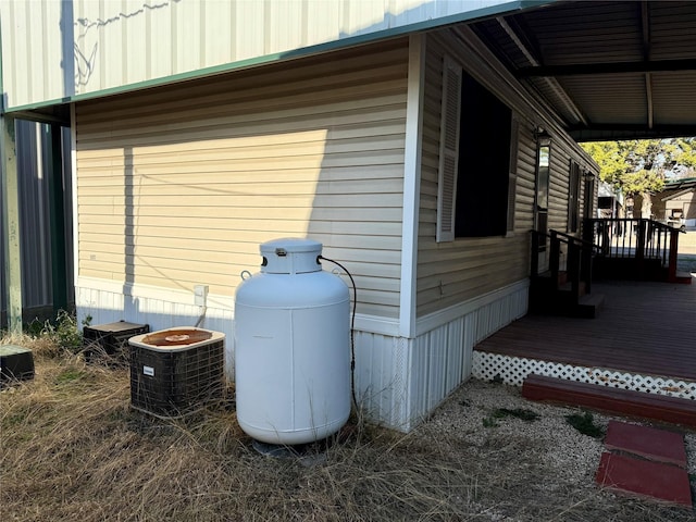 view of side of property featuring central AC unit