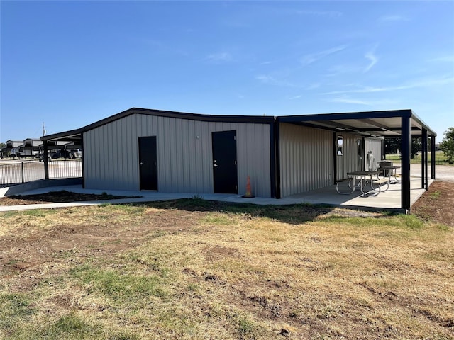 view of outbuilding featuring a yard