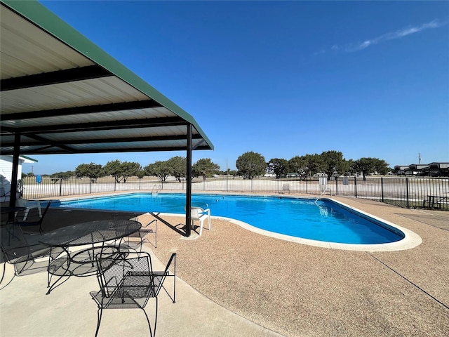 view of swimming pool featuring a patio area