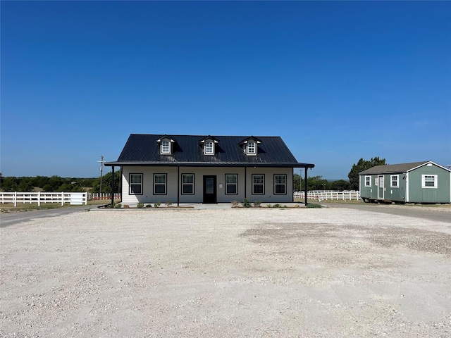 view of front facade with an outbuilding