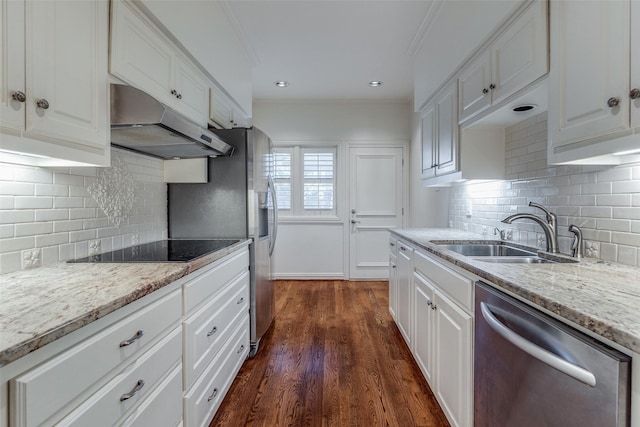 kitchen featuring stainless steel dishwasher, white cabinets, sink, and black electric stovetop