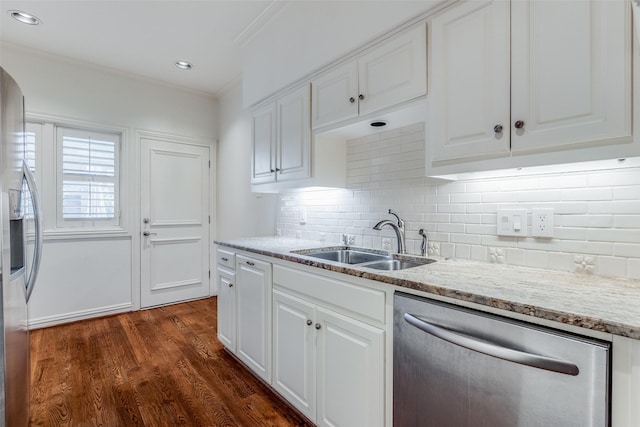 kitchen featuring stainless steel appliances, white cabinetry, dark wood-type flooring, and sink