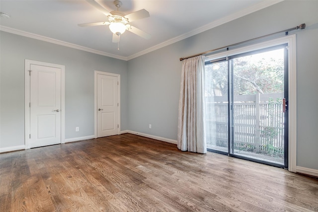 spare room with ceiling fan, crown molding, and wood-type flooring