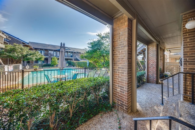 exterior space featuring a community pool