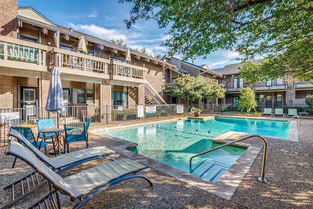 view of swimming pool featuring a patio