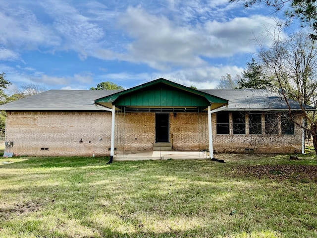 back of house featuring a yard and a patio area