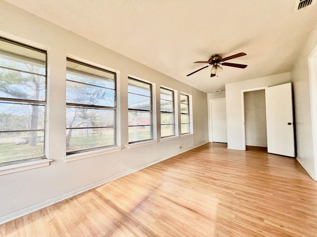 unfurnished bedroom featuring ceiling fan and light wood-type flooring