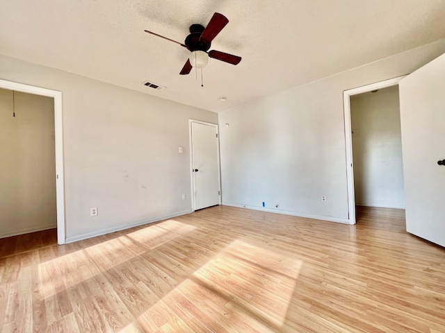 unfurnished bedroom with ceiling fan and light hardwood / wood-style flooring