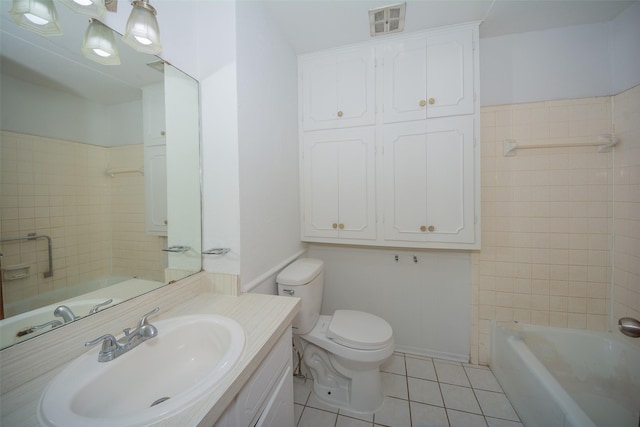 bathroom featuring tile patterned flooring, vanity, and toilet