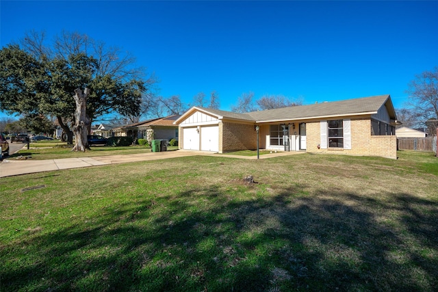 ranch-style home featuring a garage and a front lawn