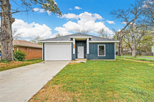 view of front of house with a front lawn and a garage