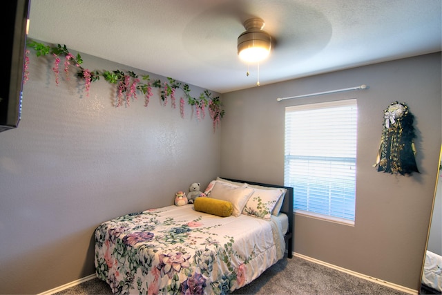 bedroom featuring ceiling fan and carpet floors