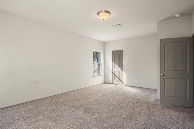 unfurnished room with carpet floors