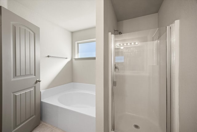 bathroom featuring separate shower and tub and tile patterned flooring