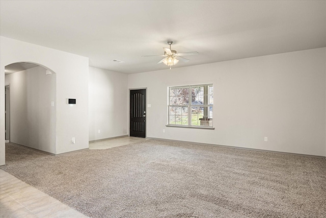 carpeted empty room with ceiling fan