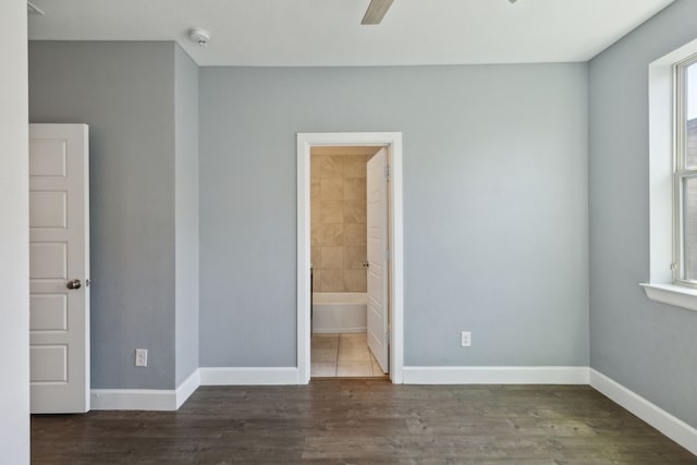 interior space featuring ceiling fan and dark wood-type flooring