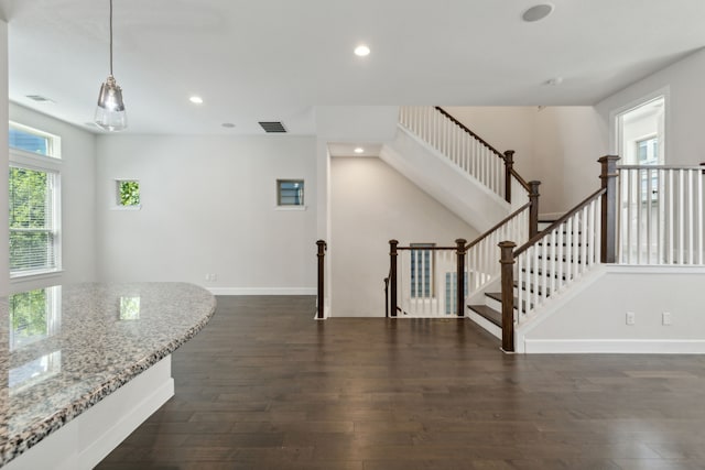 interior space with dark hardwood / wood-style floors