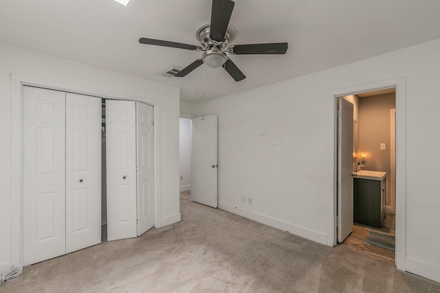 unfurnished bedroom featuring ceiling fan and light colored carpet