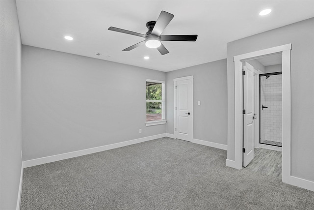 unfurnished bedroom with ceiling fan and light colored carpet