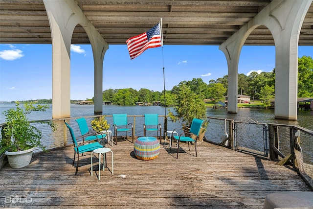 wooden deck with a water view