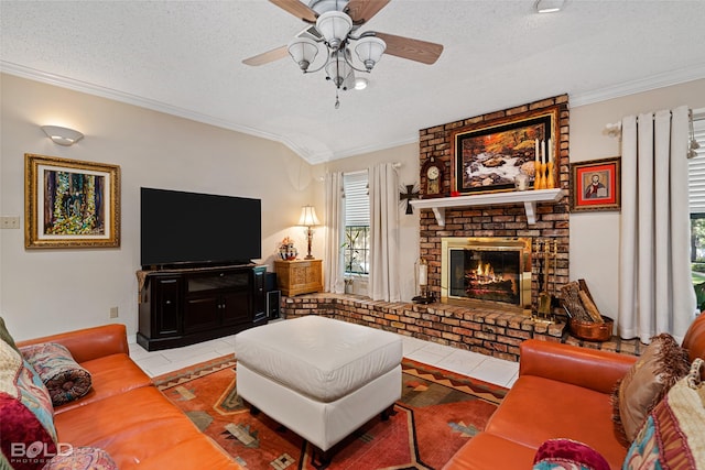 tiled living room featuring a fireplace, lofted ceiling, ceiling fan, crown molding, and a textured ceiling