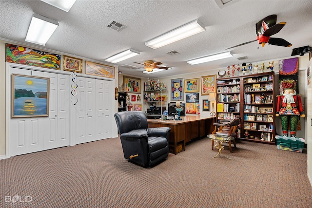 office with carpet floors, a textured ceiling, and ceiling fan