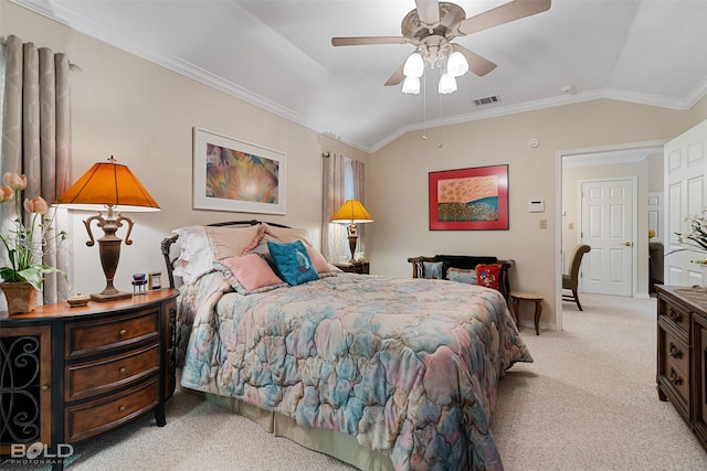 carpeted bedroom featuring ceiling fan, vaulted ceiling, and crown molding