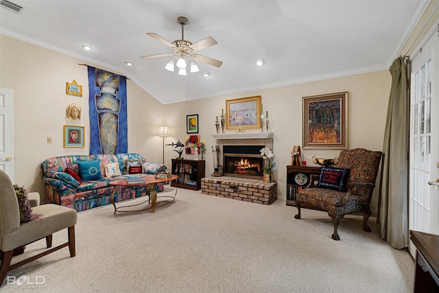 carpeted living room featuring crown molding, a fireplace, ceiling fan, and vaulted ceiling