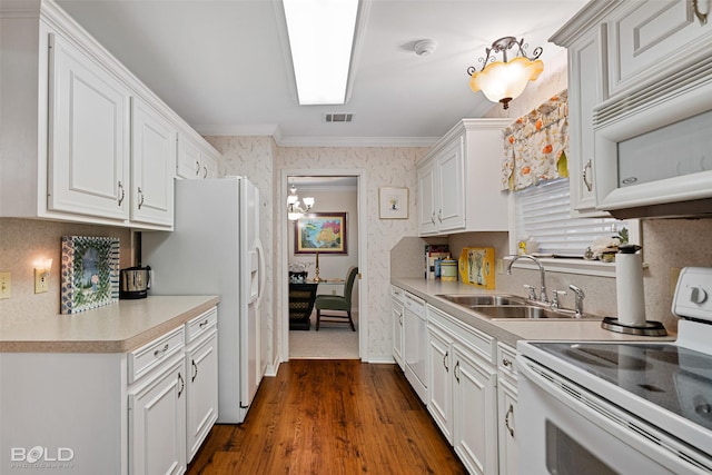 kitchen featuring white cabinetry, sink, white appliances, and crown molding