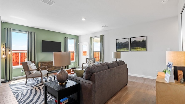 living room featuring light hardwood / wood-style flooring and plenty of natural light