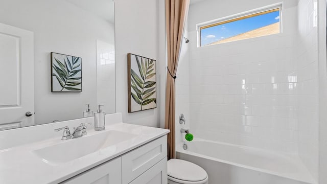 full bathroom featuring shower / tub combo with curtain, vanity, and toilet