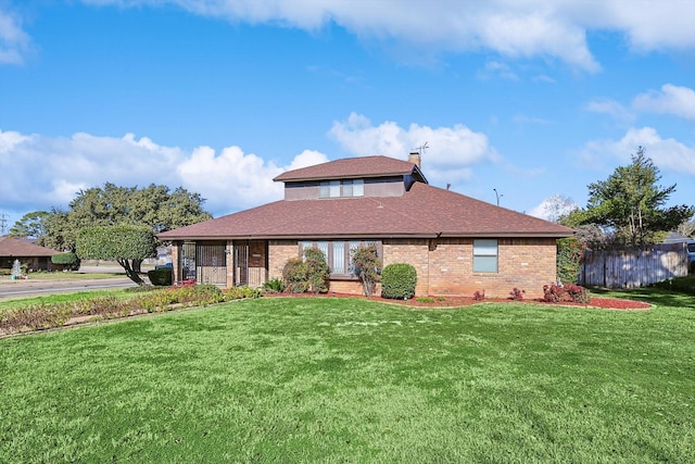 view of front of property with a front lawn