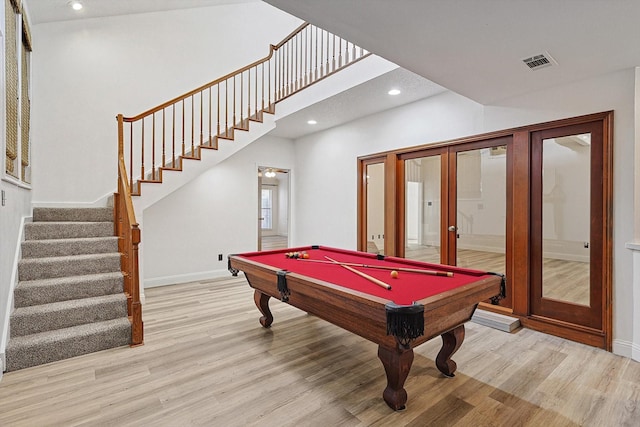 recreation room featuring french doors, billiards, and light hardwood / wood-style floors