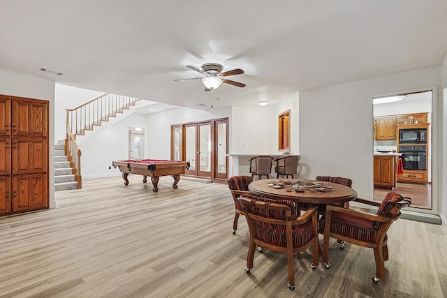 rec room with light hardwood / wood-style flooring, billiards, and ceiling fan